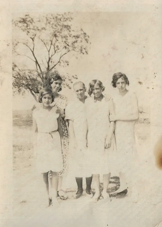 Veleta Headrix (Delaney) around age nine, pictured with family members outdoors